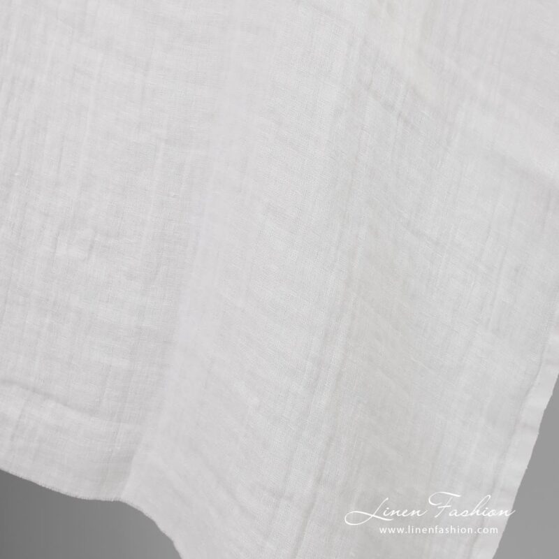 Off-white linen fabric in checks, washed