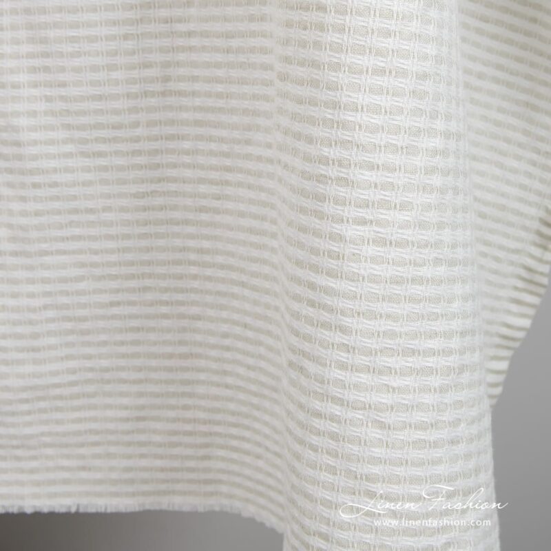 Light grey linen cotton fabric in checks, specially washed to increase softness