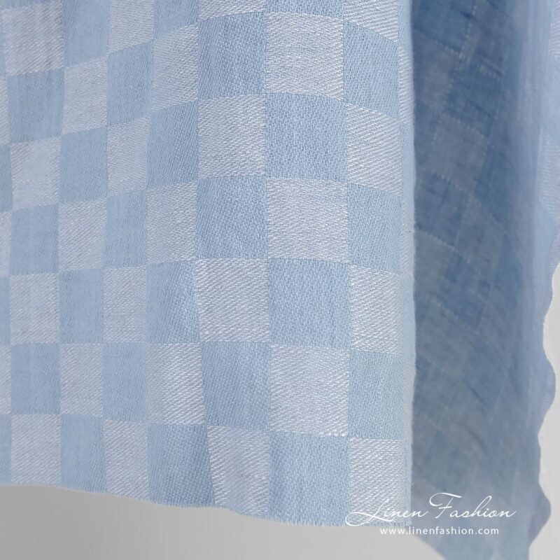 Bluish linen cotton fabric in checks, specially washed to increase softness