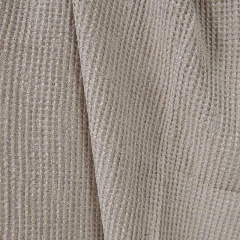 Washed linen cotton fabric beige waffle close up detail