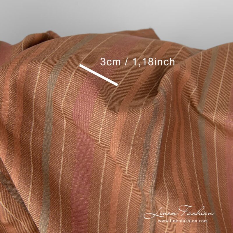 Dark brown stripes woven in diagonal lines that gives to the fabric a certain vibrancy and radiance