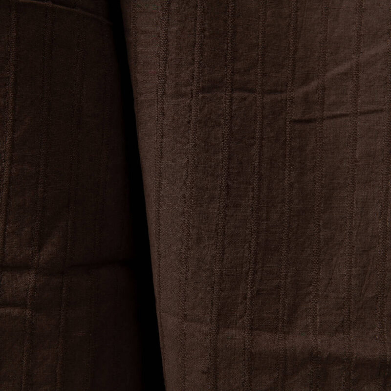 Dark brown washed linen cotton fabric close up detail