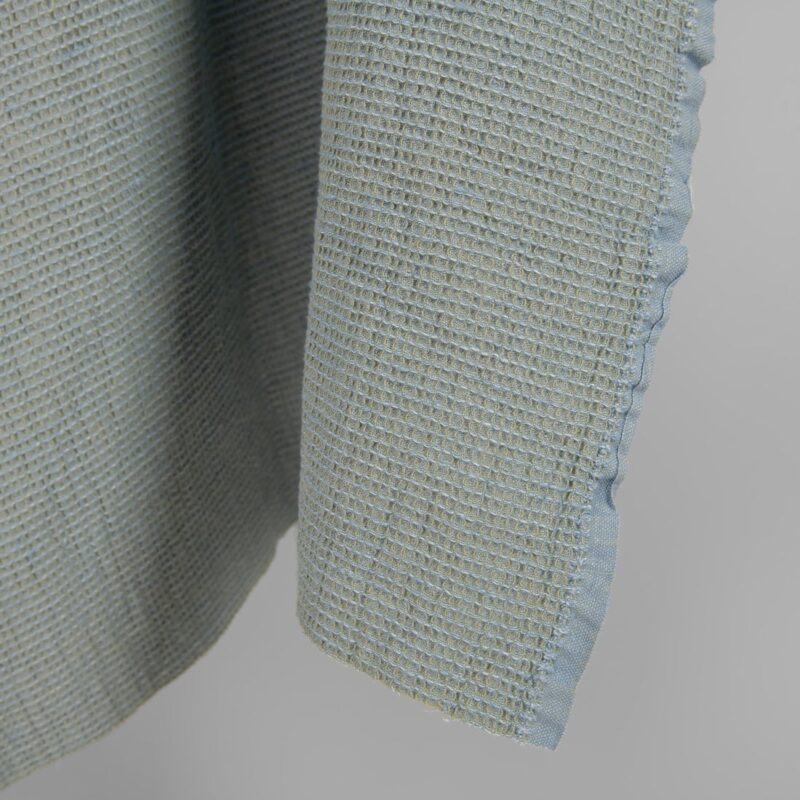 Washed linen cotton fabric blueish green waffle edge view