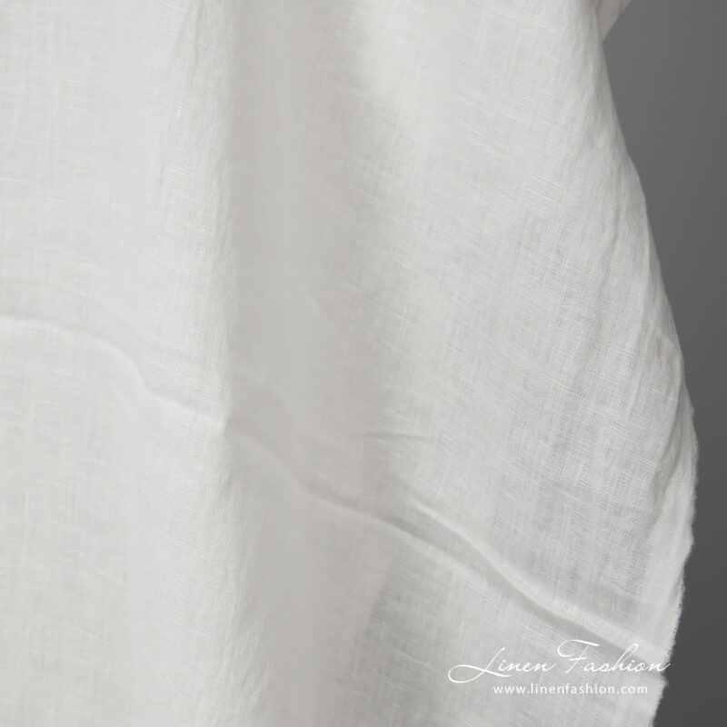 Lightweight washed linen fabric white colour close up view