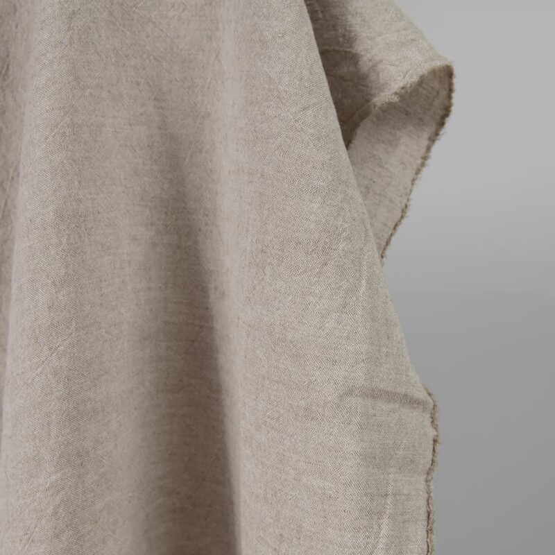 Wide washed linen cotton fabric sand colour edge view