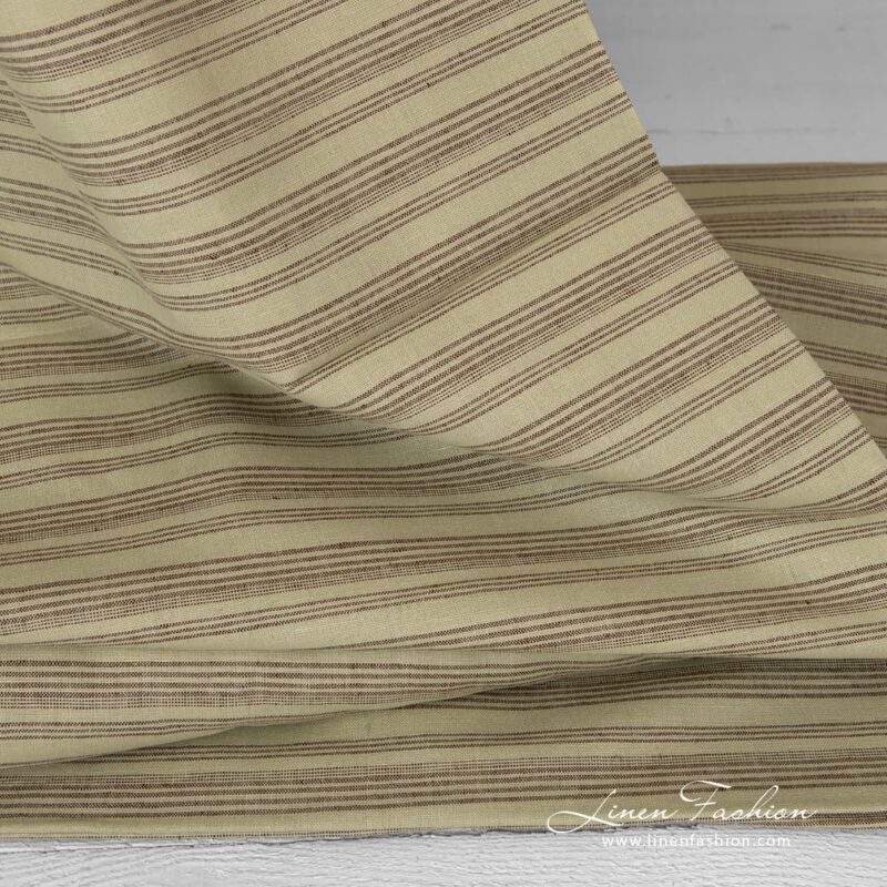 Pale green dyed linen cotton fabric.