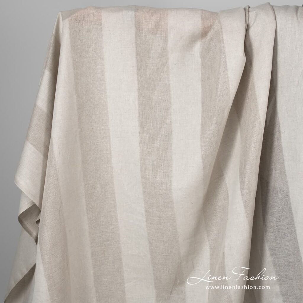 Grey linen cotton fabric with open weave stripes.
