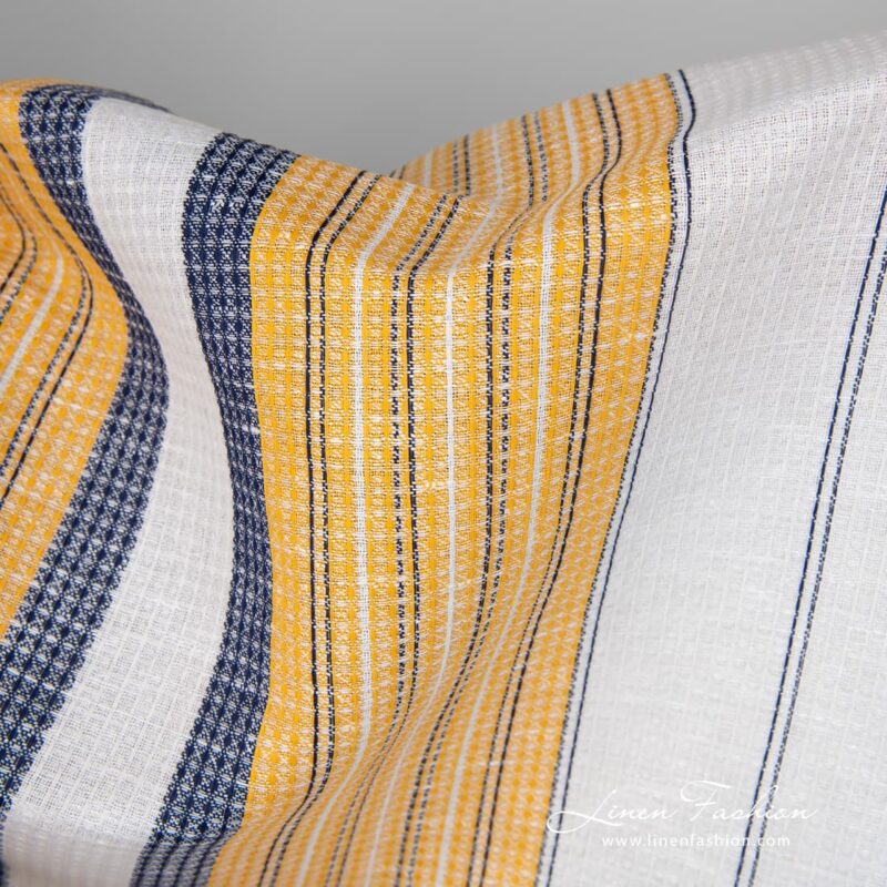 Linen cotton fabric white waffle with yellow blue stripes close up view