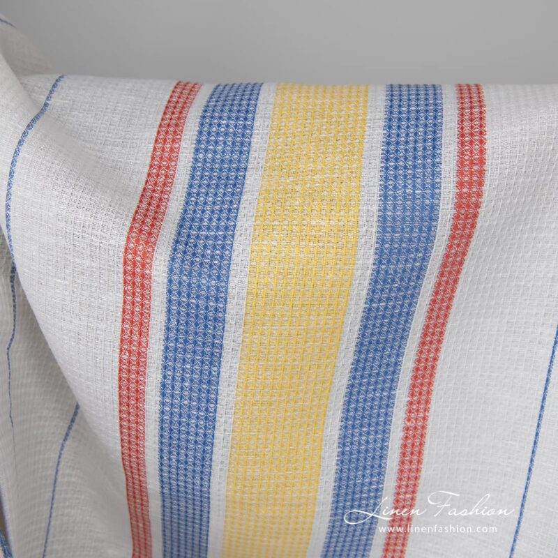 Linen cotton fabric white waffle with yellow red stripes close up detail