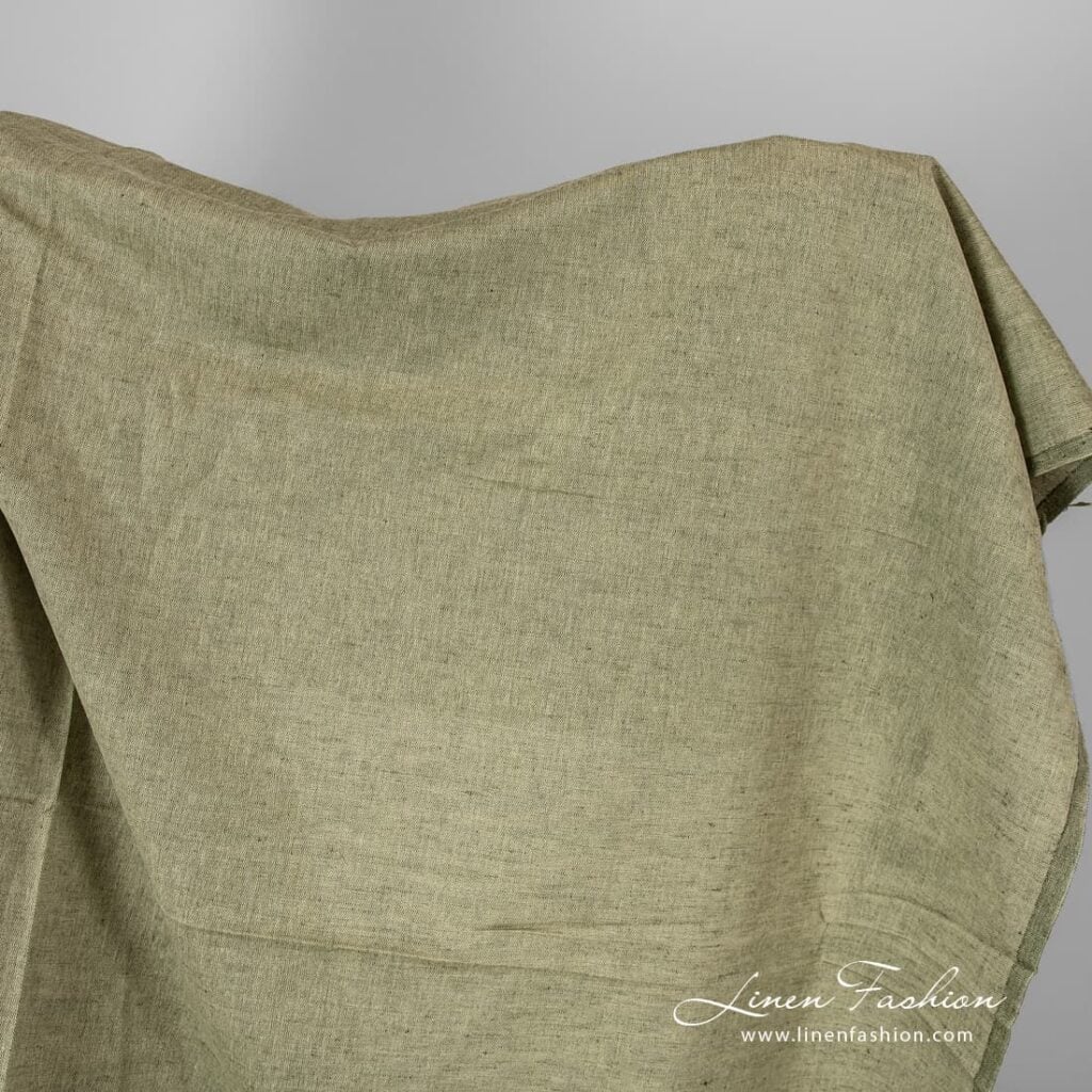 Linen cotton fabric in olive green melange.