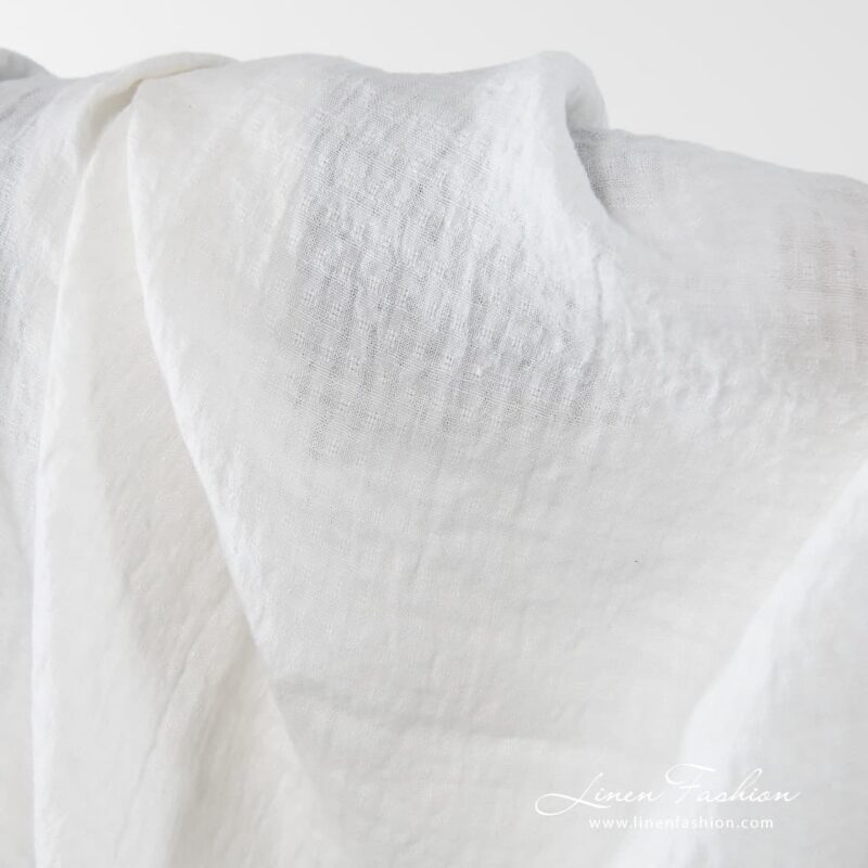 Washed 100% linen fabric in off white.
