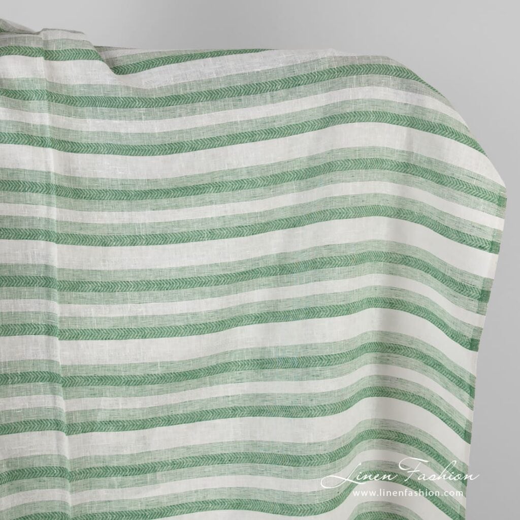 Linen fabric in green and white herringbone stripes