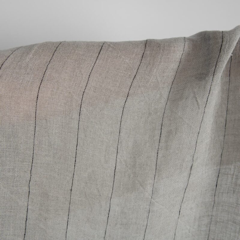 Natural transparent linen fabric with black stripes washed close up detail