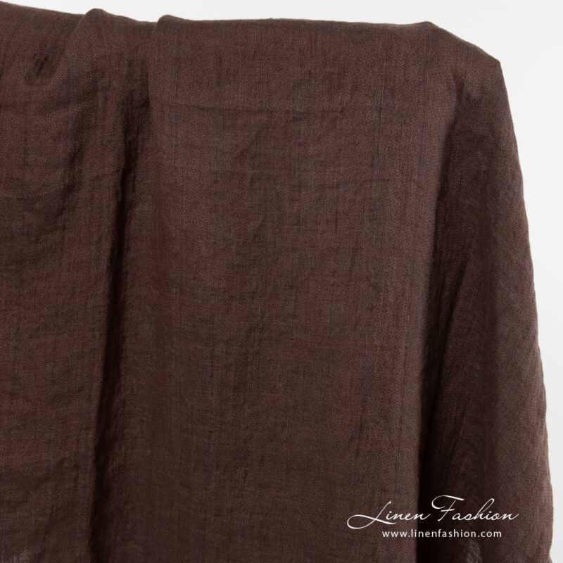 Washed linen fabric in brown colour.
