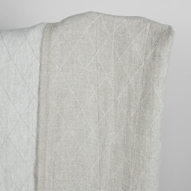 Grey double-sided washed linen fabric with a pattern darker side