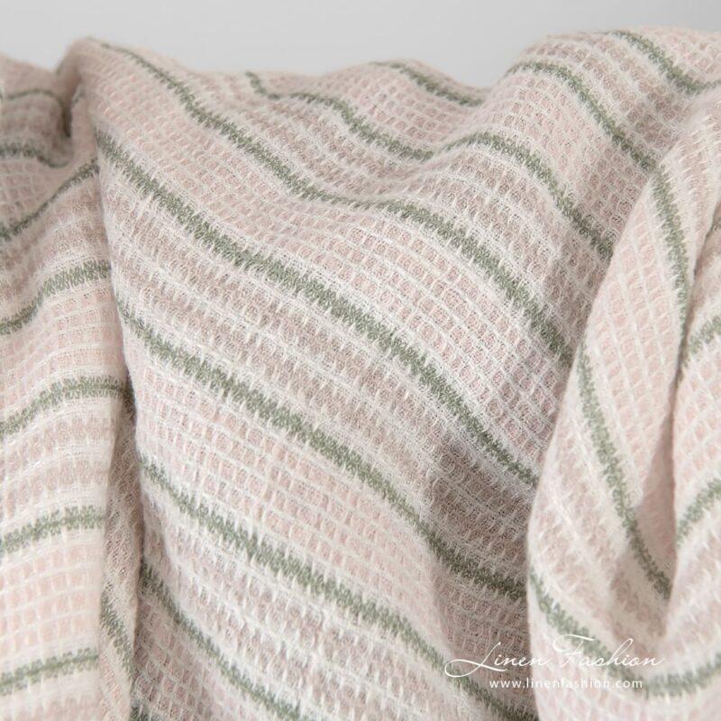 Striped pink linen fabric in waffle pattern, washed