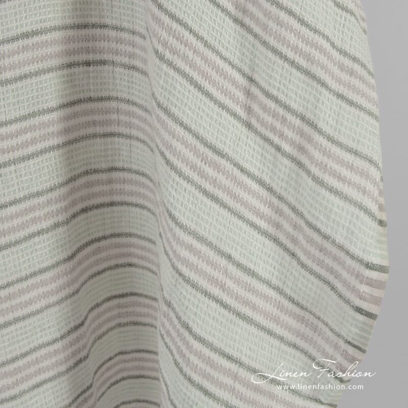 Green striped linen fabric in waffle pattern, specially washed to increase softness