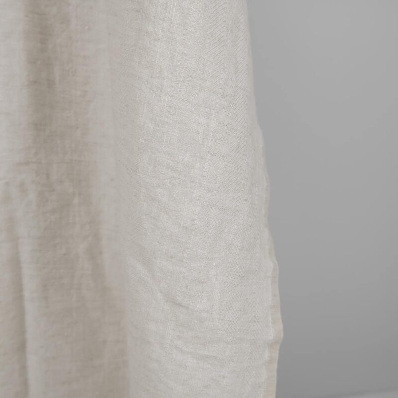 Washed linen wool fabric beige in herringbone pattern edge