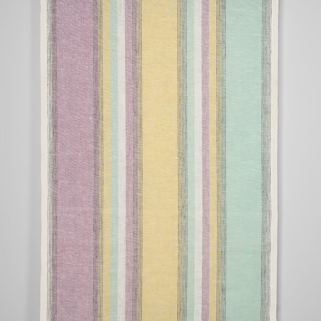 Narrow linen fabric in pastel multicolour stripes