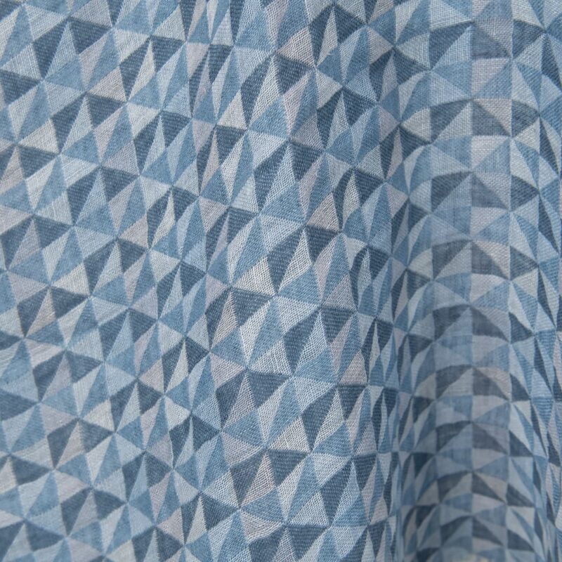 Washed linen fabric in blue triangles close up detail
