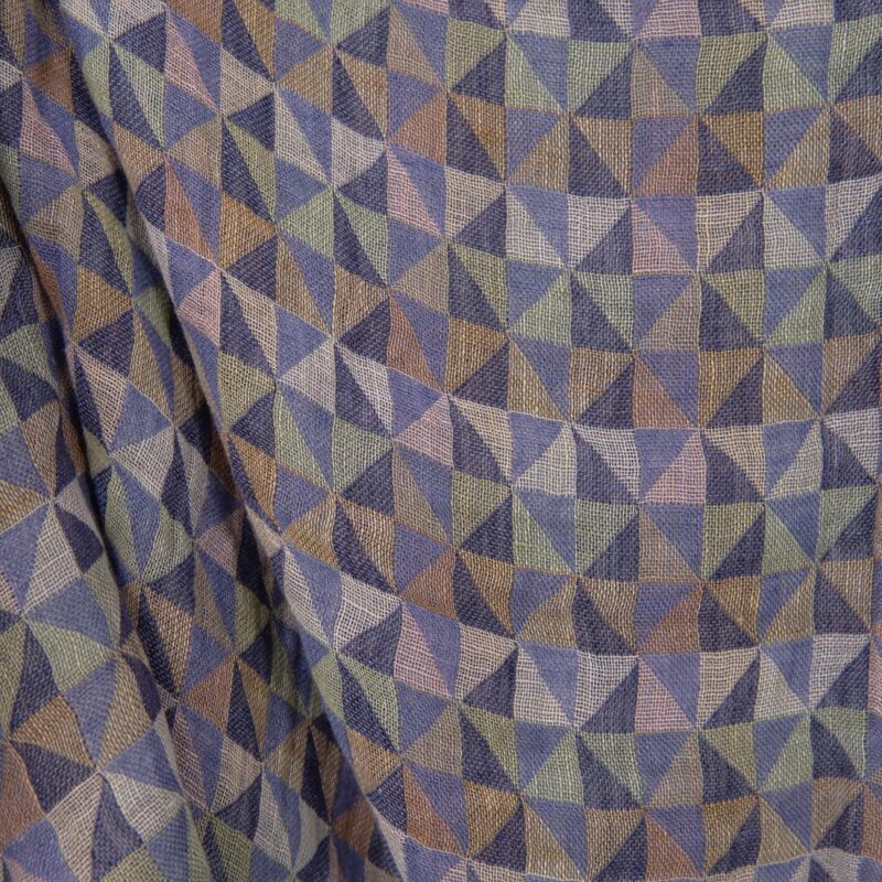 Washed linen fabric in violet multicolour triangles close up detail