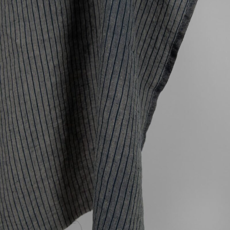 Washed linen fabric grey with thin black stripes edge