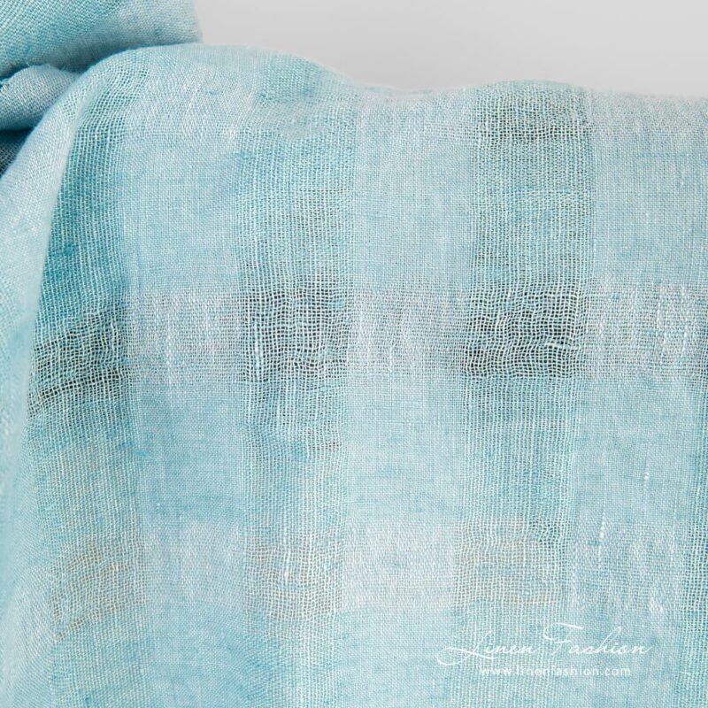 Linen fabric in light blue and light turquoise melange