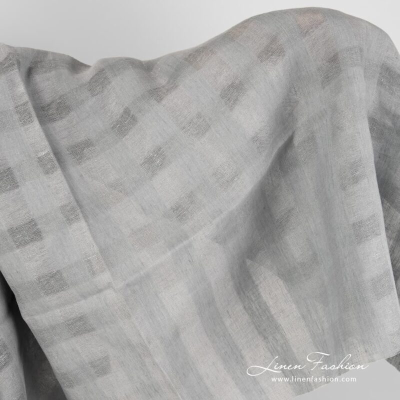 Grey linen fabric with sheer checks.