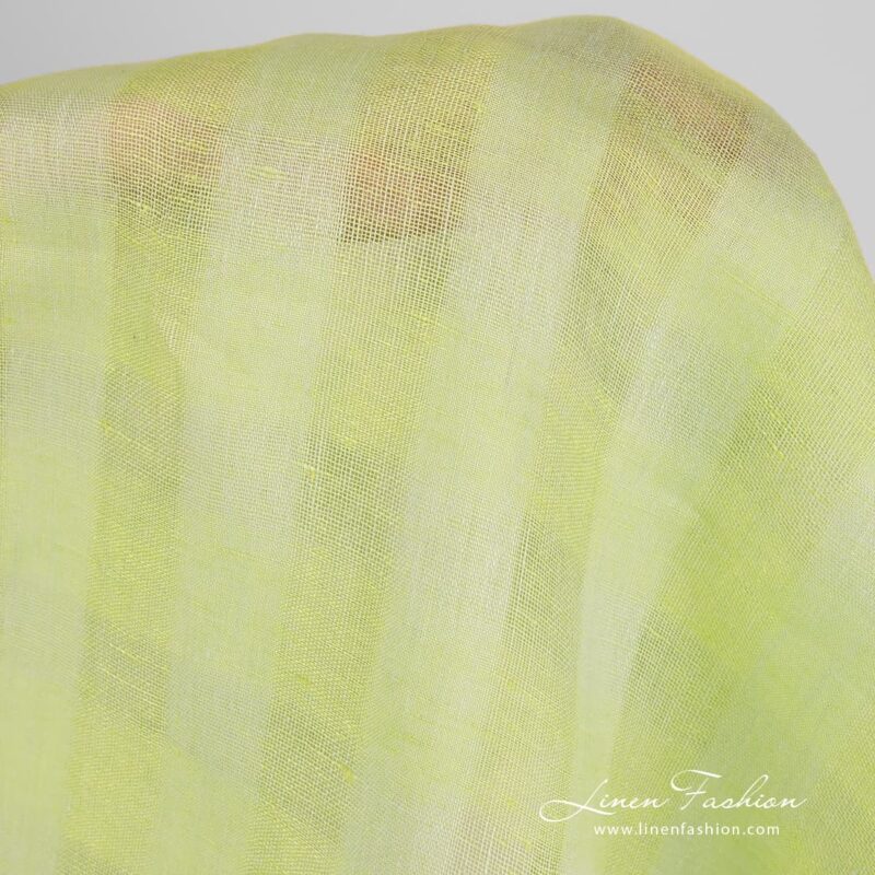 Checked linen fabric in light lime green colour.