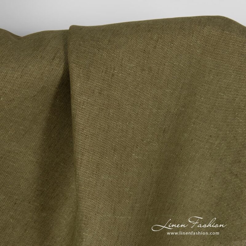 Moss green dyed linen fabric in diagonal pattern.