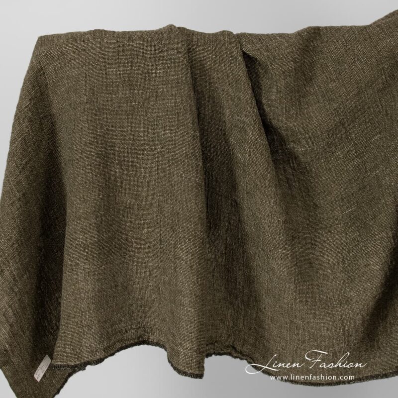 Linen fabric in moss green, washed.