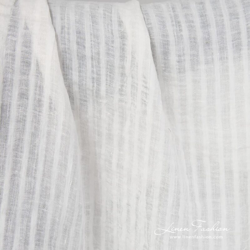 Off white linen fabric in stripes.