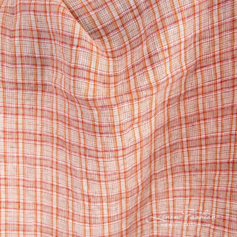 Orange linen fabric in checks, specially washed to increase softness