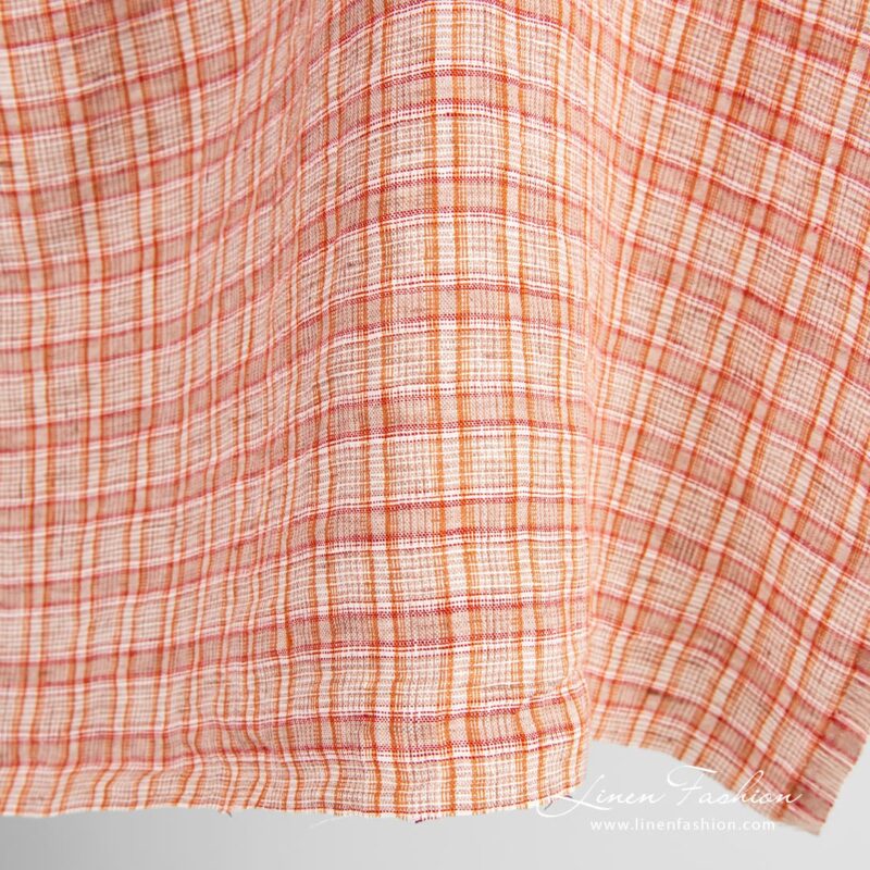 Orange linen fabric in checks, specially washed, for home textile and clothes