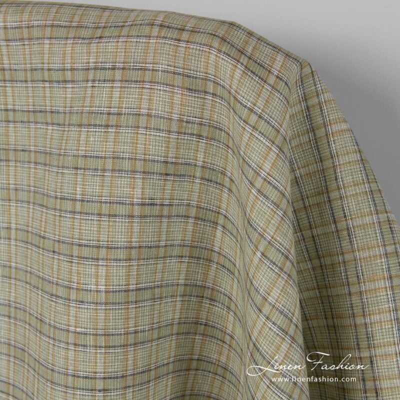 Green coloured checked linen fabric.