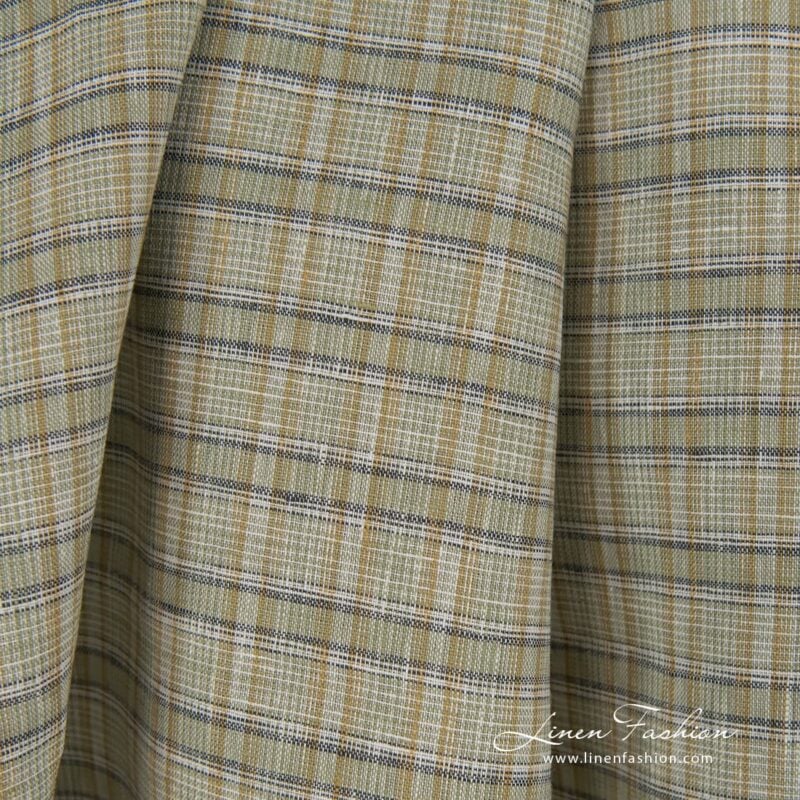 Green dyed 100% linen fabric in checks.