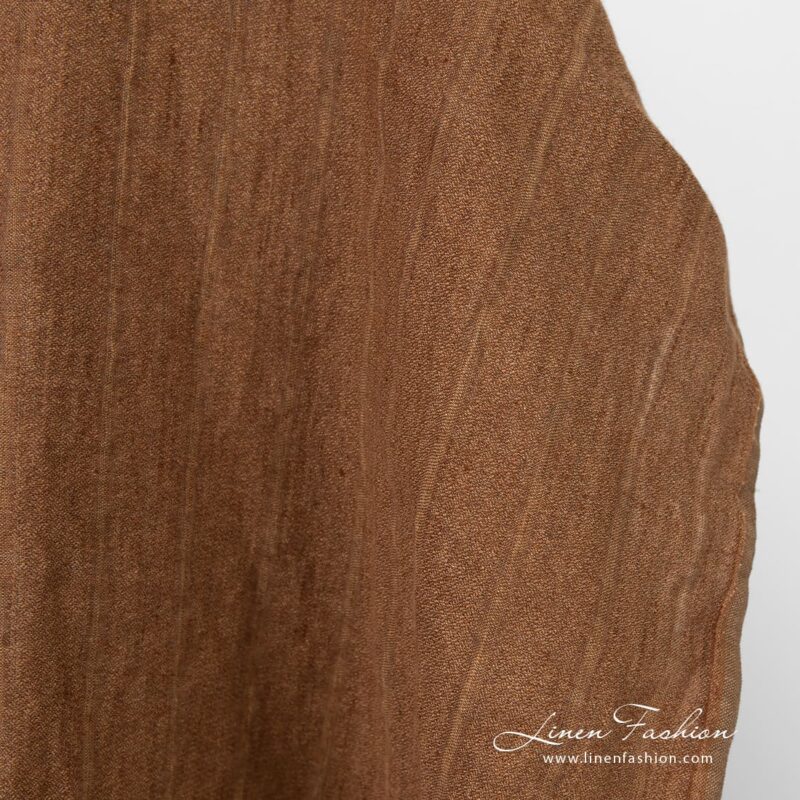 Striped linen fabric in brown color, washed