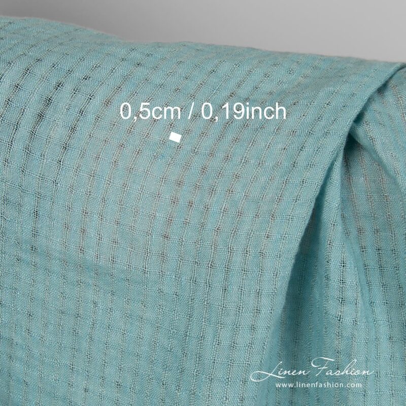 Linen fabric in transparent checks, woven from blue green yarns