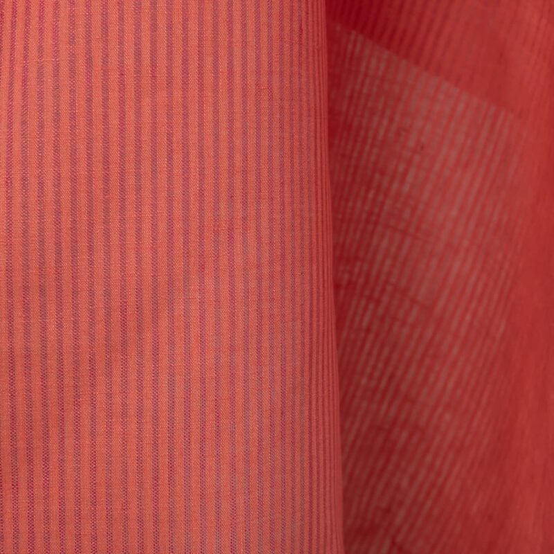 Linen fabric in coral and pink stripes close up detail