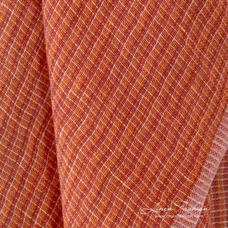 Transparent linen fabric in orange melange, perfect for curtains, shawls