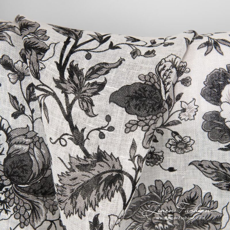 100% linen fabric decorated with black flowers.