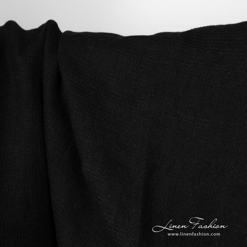 Washed linen fabric solid black waffle close up detail