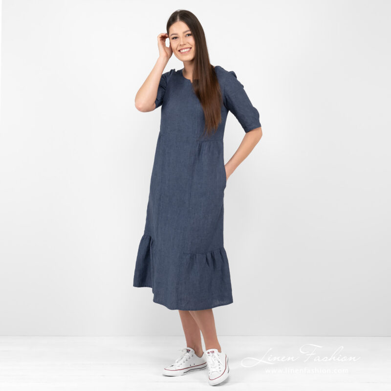 dark blue long linen dress with ruffles at bottom.