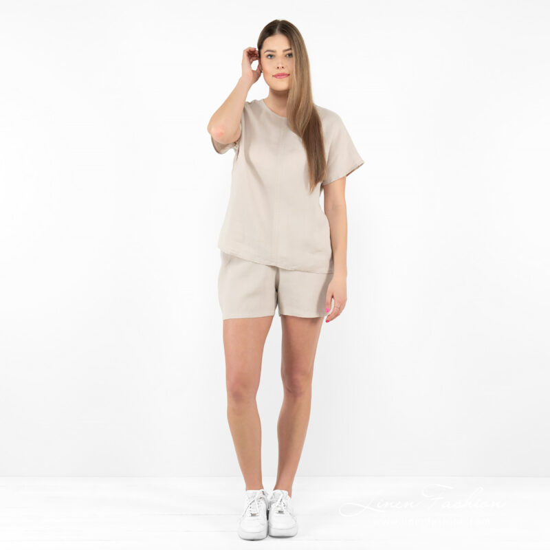 beige linen shorts in set with blouse.