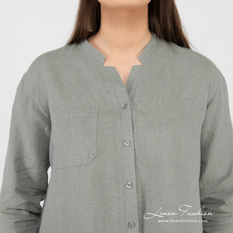 green linen blouse, button closure, V neck form.