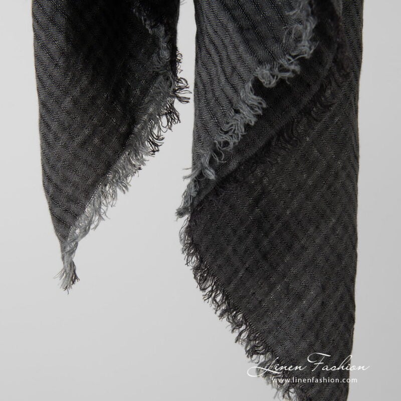 grey linen scarf with loose fringes around.