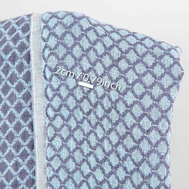 Blue double-sided washed linen fabric in a diamond pattern, with measurements