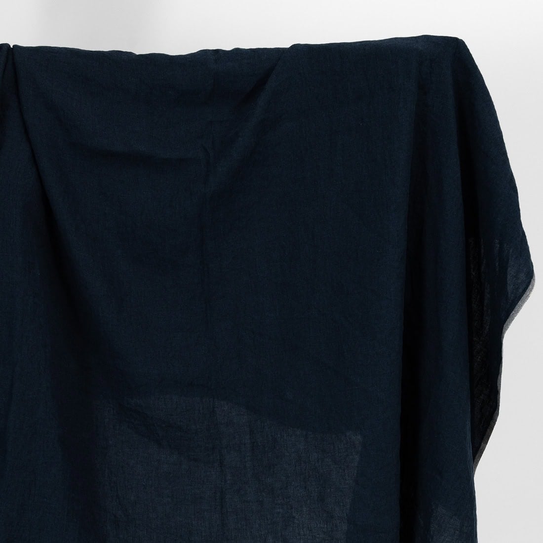 Linen fabric in blue black colour, washed.