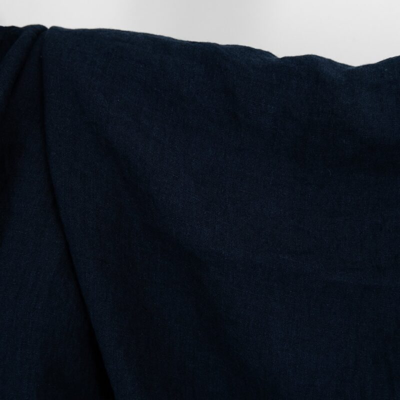 Washed linen fabric in blue black colour.